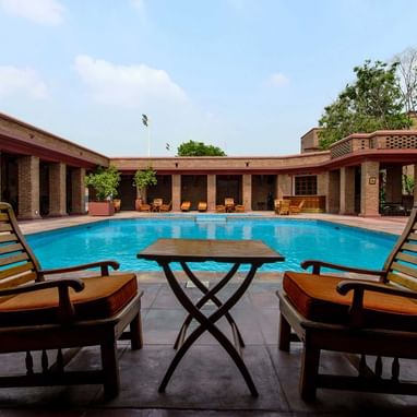 Lounge area by the hotel pool at Faisalabad Serena Hotel